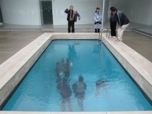 Go one step further with your pool art like this installation by Leandro Erlich.   (http://avaxnews.net/fact/Swimming_Pool_Art_Installation_by_Leandro_Erlich.html)  It’s actually quite spooky!  